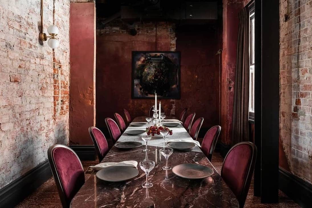 a private dining room in Perth featuring a red marble table